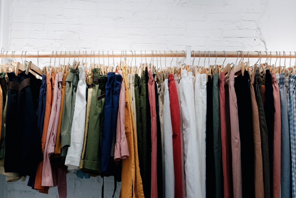 A clothes rail displaying various items of clothing